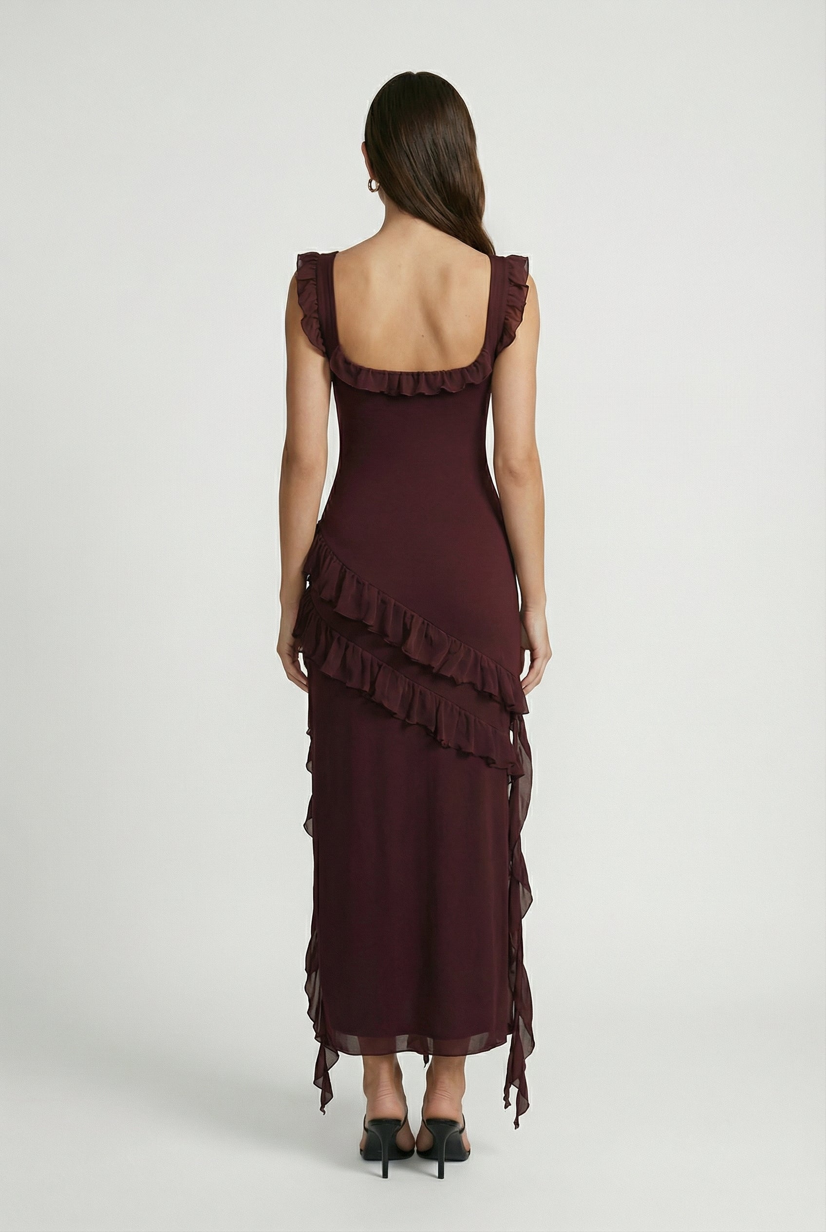 Lumina Wear Victoria maxi dress featuring an elegant open-back design and flattering silhouette in brown fabric.