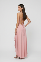 Elegant pink Victoria dress with asymmetric hem and flowy design, women's dress by Lumina Wear, perfect for stylish occasions.