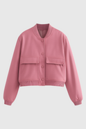 Elegant pink bomber jacket from Lumina Wear featuring timeless design, showcased with a stylish fit and soft fabric.