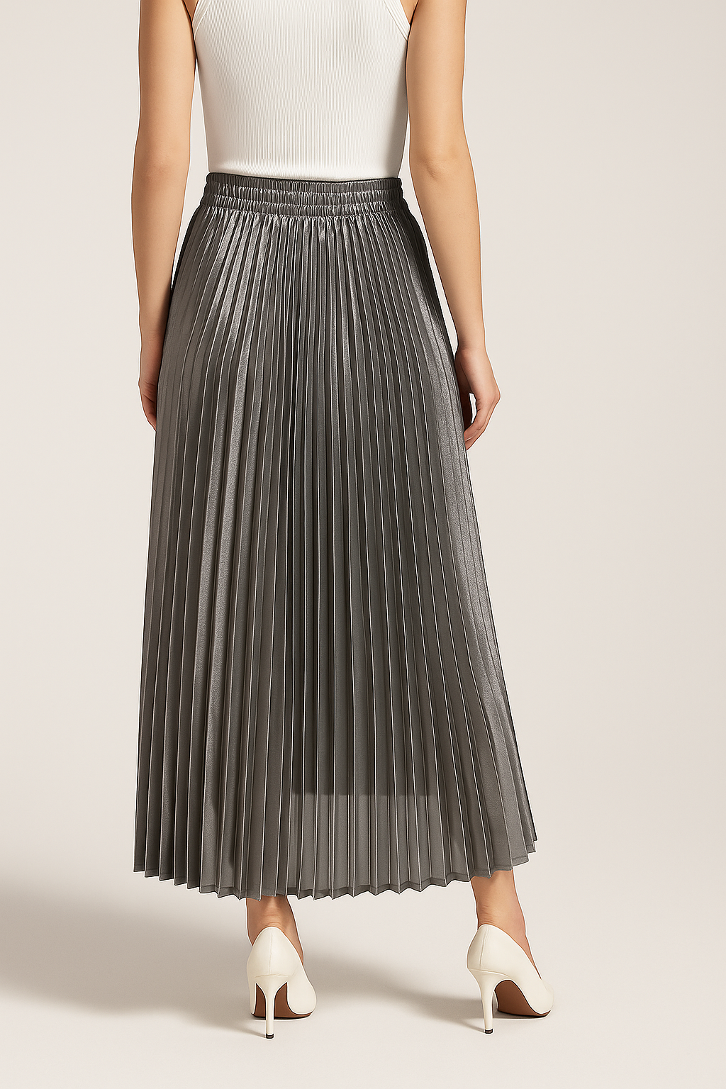 Gold pleated maxi skirt for women by Lumina Wear, featuring elegant pleats and a flowing design in the Victoria style.
