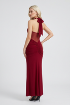 Victoria elegant red drape maxi dress by Lumina Wear, featuring flowing fabric and sophisticated style, perfect for special occasions.
