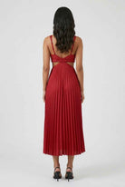 Elegant red pleated midi dress by Lumina Wear, featuring a flattering fit and sophisticated style perfect for special occasions.