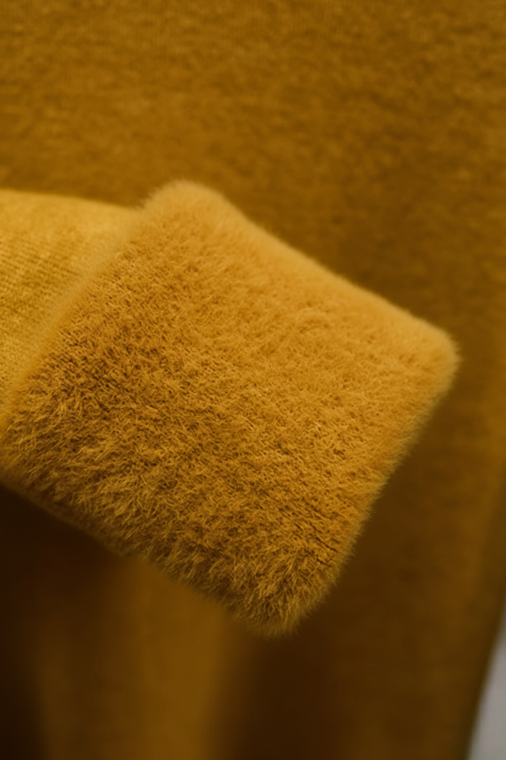 Grey Victoria Lumina Wear slim fit turtleneck sweater, close-up of the elegant sweater highlighting its soft knit fabric.
