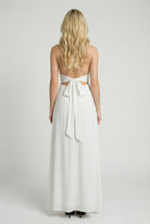Elegant white backless summer dress by Lumina Wear featuring a flattering silhouette, perfect for warm weather occasions.