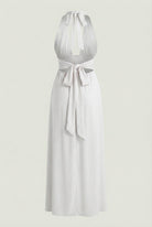 Elegant white backless summer dress by Lumina Wear featuring a flattering silhouette, perfect for warm-weather occasions.