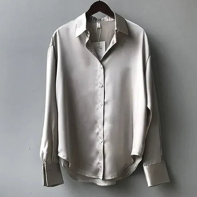 Elegant white button-down blouse by Lumina Wear, Victoria style, relaxed fit, crisp fabric, and classic collar detail.