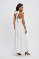 Elegant white Victoria midi dress by Lumina Wear featuring a tailored fit, showcased on a model.