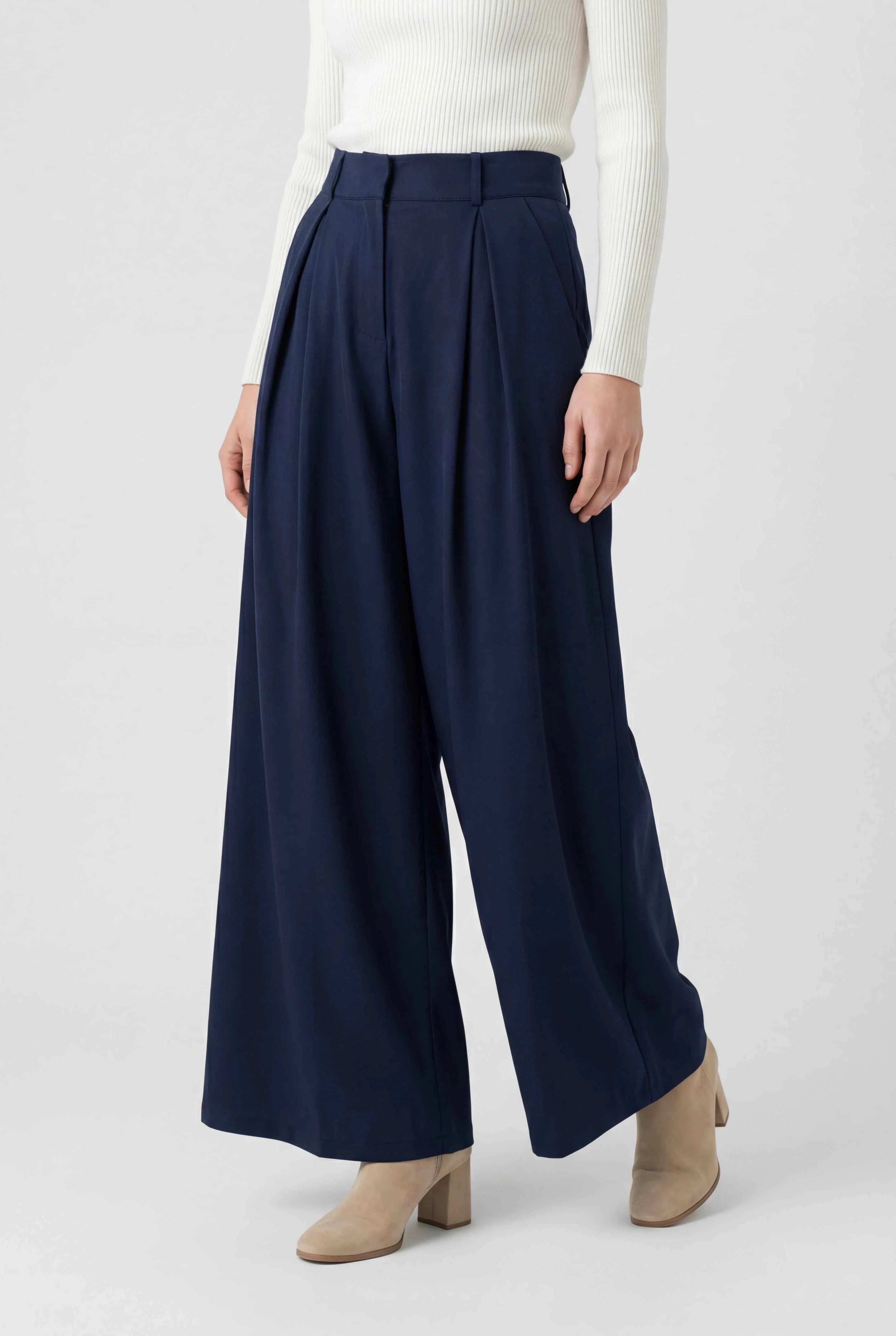 Navy blue Victoria wide-leg trousers from Lumina Wear featuring stretch fabric and tailored fit, shown on a model.