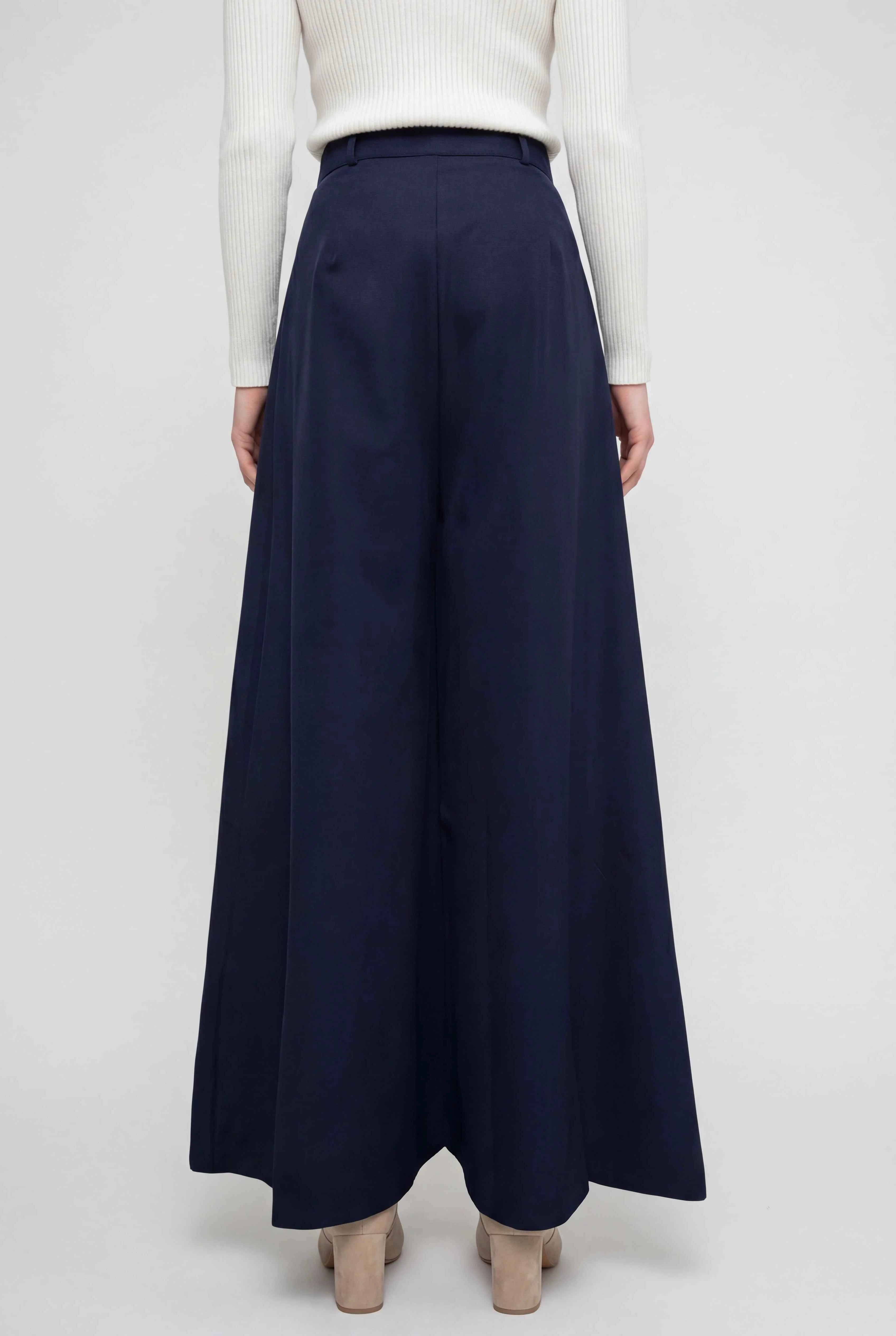 Navy blue Victoria wide-leg trousers by Lumina Wear, featuring stretch fabric and a relaxed fit for comfortable, elegant style.