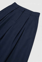 Navy blue Victoria wide-leg trousers from Lumina Wear featuring stretch fabric and elegant fit, displayed on a neutral background.