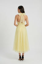 Yellow midi dress with high neck design from Lumina Wear, elegant women's dress perfect for stylish occasions.