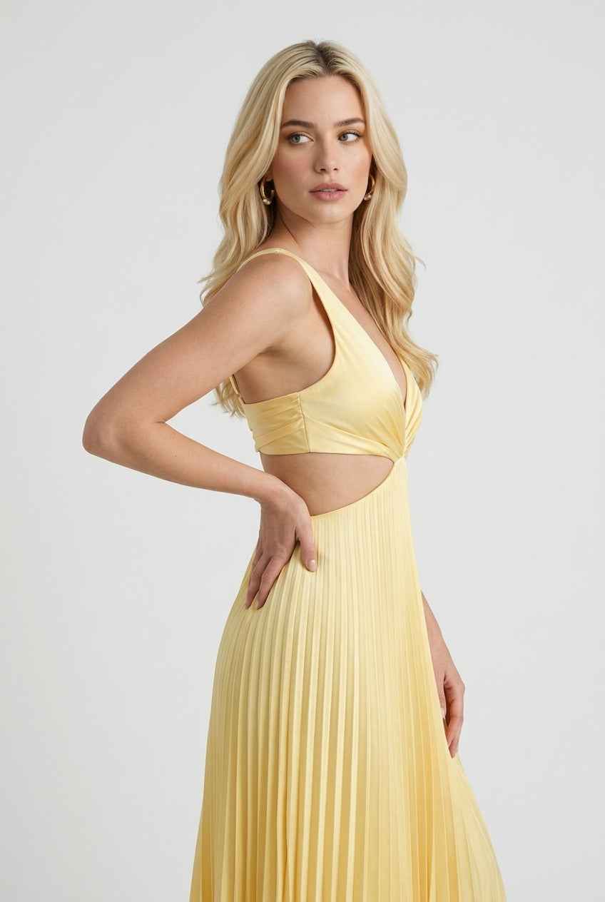 Yellow pleated dress by Lumina Wear featuring a flowing silhouette and elegant design, perfect for women’s fashion.