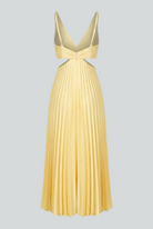 Yellow pleated dress by Lumina Wear featuring a flowing silhouette and elegant design, perfect for women’s fashion.