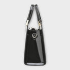 Black Victoria Lumina handbag with glossy crocodile pattern and structured design, featuring elegant stitching and gold-tone hardware.
