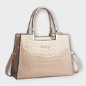 Lumina Victoria glossy crocodile pattern handbag with structured design in black, stylish and elegant for everyday use.