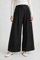 Black Victoria high-waisted wide-leg trousers by Lumina Wear, featuring an elegant fit and relaxed silhouette.