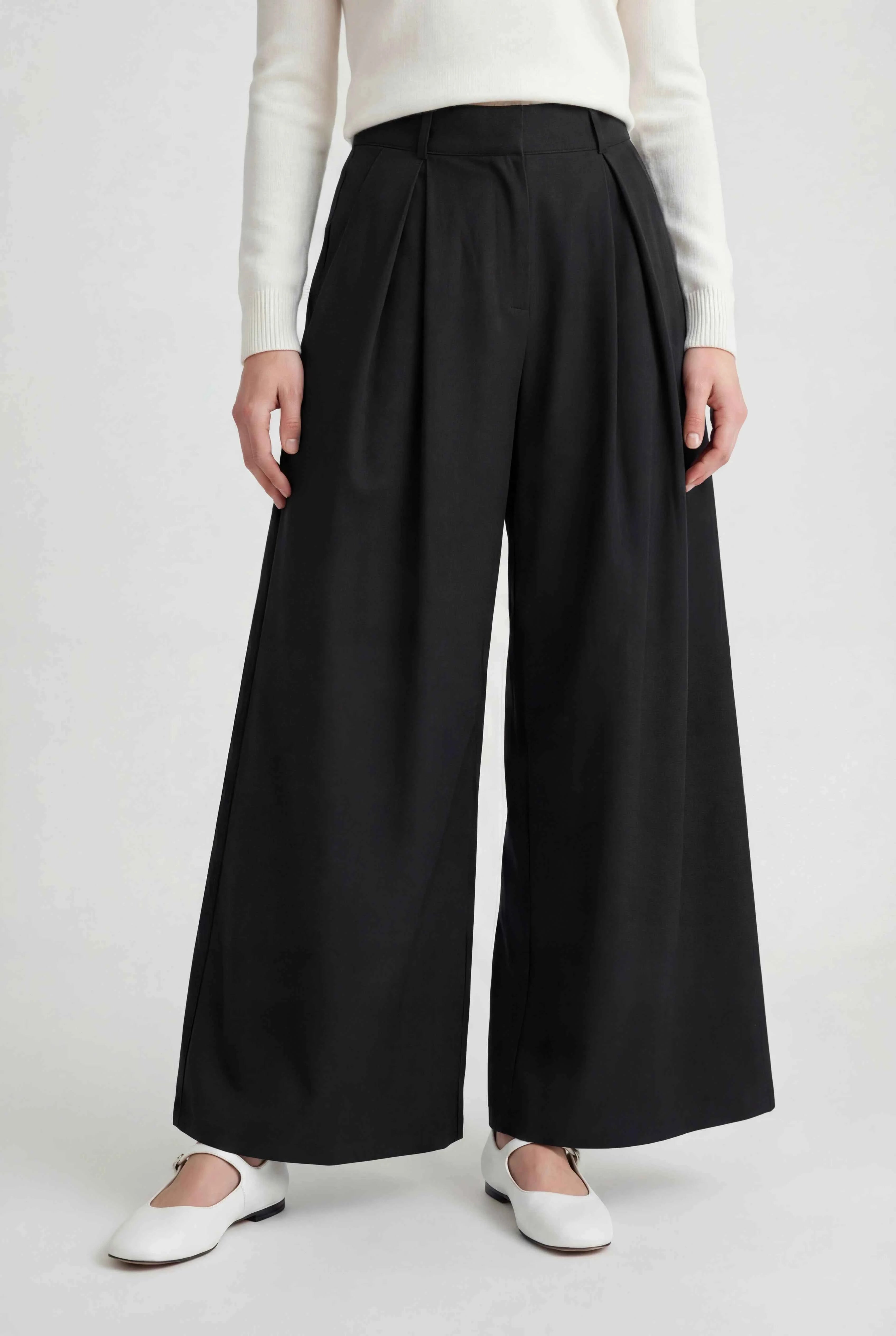 Black Victoria high-waisted wide-leg trousers by Lumina Wear, featuring an elegant fit and relaxed silhouette.