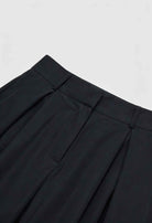 Black Victoria high-waisted wide-leg trousers by Lumina Wear featuring an elegant fit, styled with a relaxed and sophisticated look.