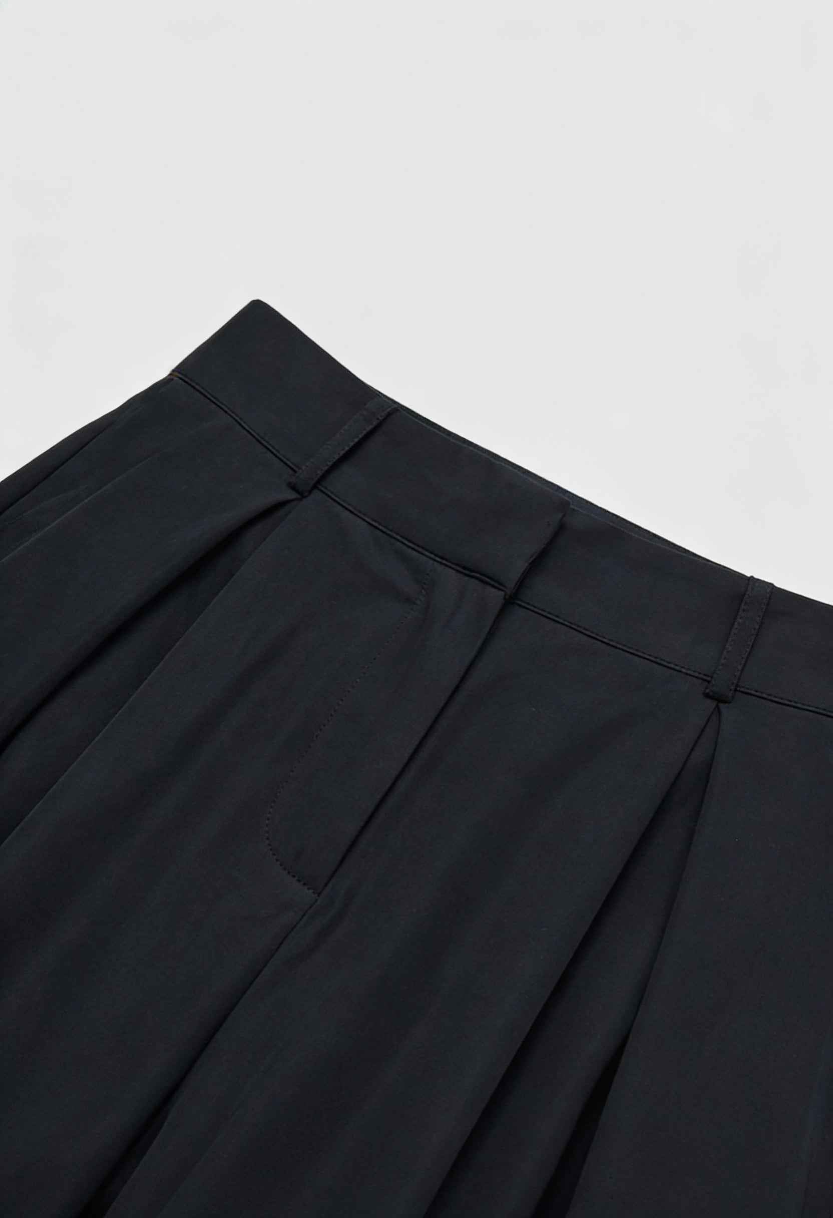 Black Victoria high-waisted wide-leg trousers by Lumina Wear featuring an elegant fit, styled with a relaxed and sophisticated look.
