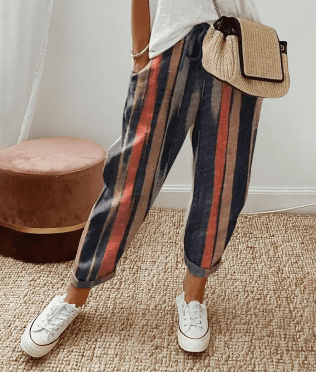 Lightweight beige casual trousers with relaxed fit from Lumina Wear, shown with subtle print details and comfortable design.