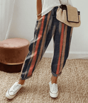 Lightweight beige casual trousers with relaxed fit from Lumina Wear, featuring a subtle printed design.