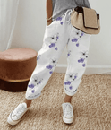 Lightweight beige casual trousers with relaxed fit from Lumina Wear, featuring a subtle printed design, shown on a model.