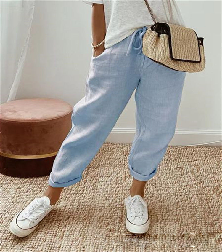 Lightweight beige casual trousers with a relaxed fit from Lumina Wear, featuring a subtle print and comfortable design.