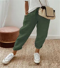 Lightweight beige casual trousers by Lumina Wear featuring a relaxed fit and subtle print, ideal for comfortable everyday wear.