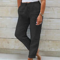 Light beige lightweight summer trousers with elastic waist from Lumina Wear, shown in a relaxed fit style.
