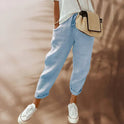 Lightweight black casual pants with elastic waist from Lumina Wear, designed for comfortable everyday wear, shown on a model.