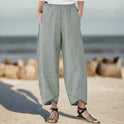 White Victoria Lumina Wear lightweight relaxed fit trousers with casual, comfortable style, shown in a khaki color on XS size model.
