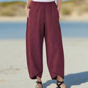 Lightweight white relaxed fit trousers by Lumina Wear, casual khaki pants with comfortable fit, shown in size XS.