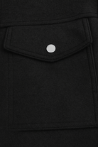 Black Victoria Lumina Wear modern cropped jacket with pockets, stylish and versatile outerwear for casual or semi-formal outfits.