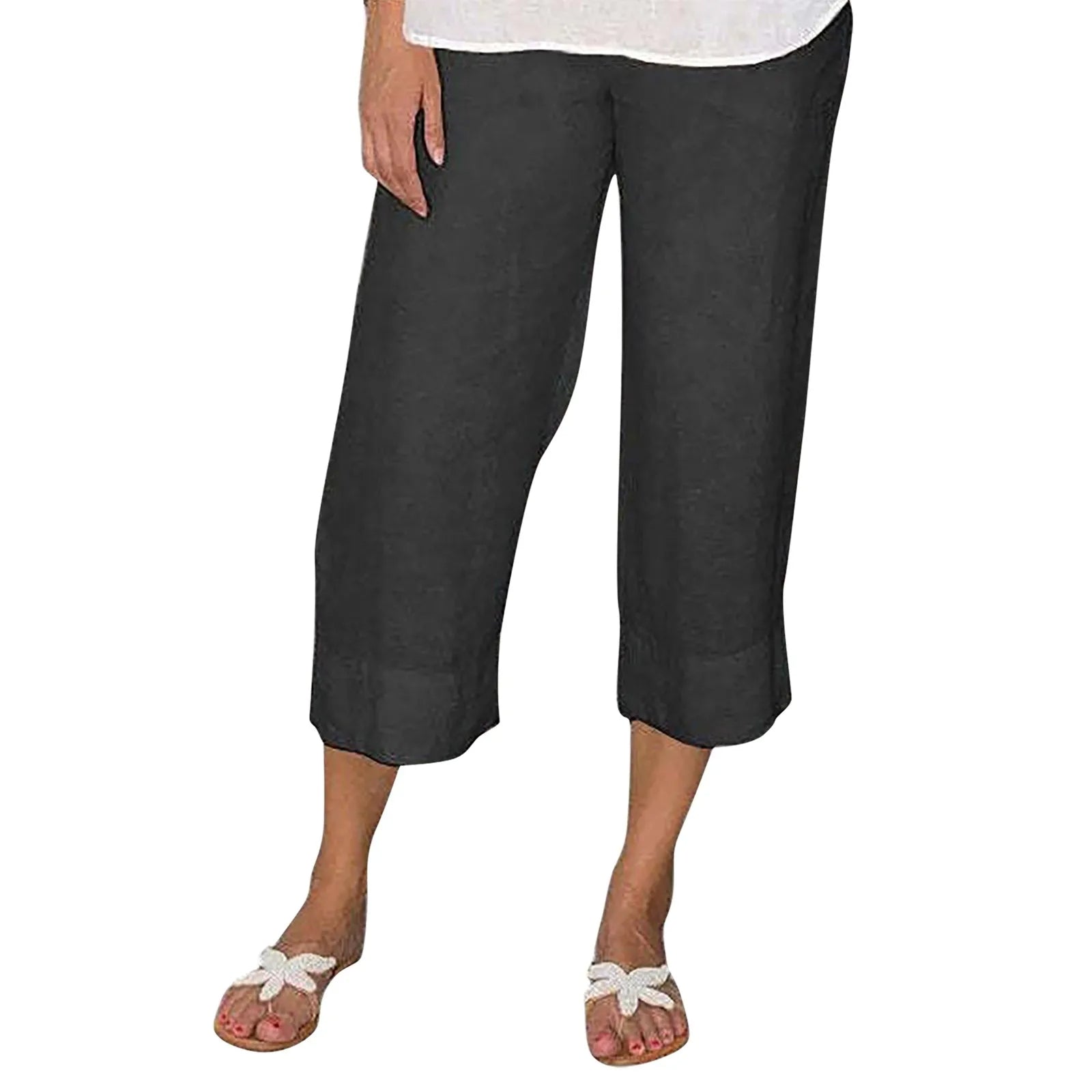 Victoria beige linen trousers by Lumina Wear with relaxed fit and drawcord, shown laid flat on a neutral background.