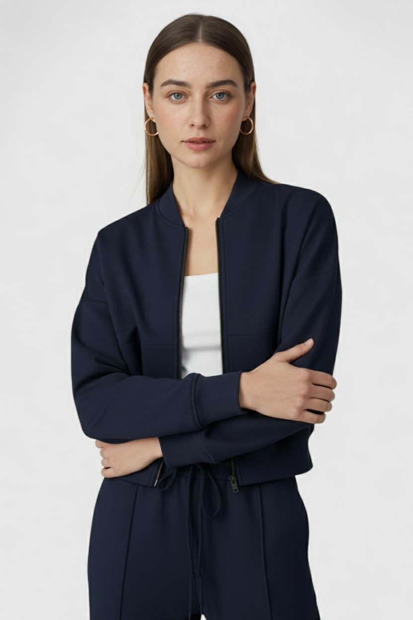 Victoria Lumina Wear relaxed fit dark blue activewear set with zippered accents, includes sweatpants and sweatshirt.