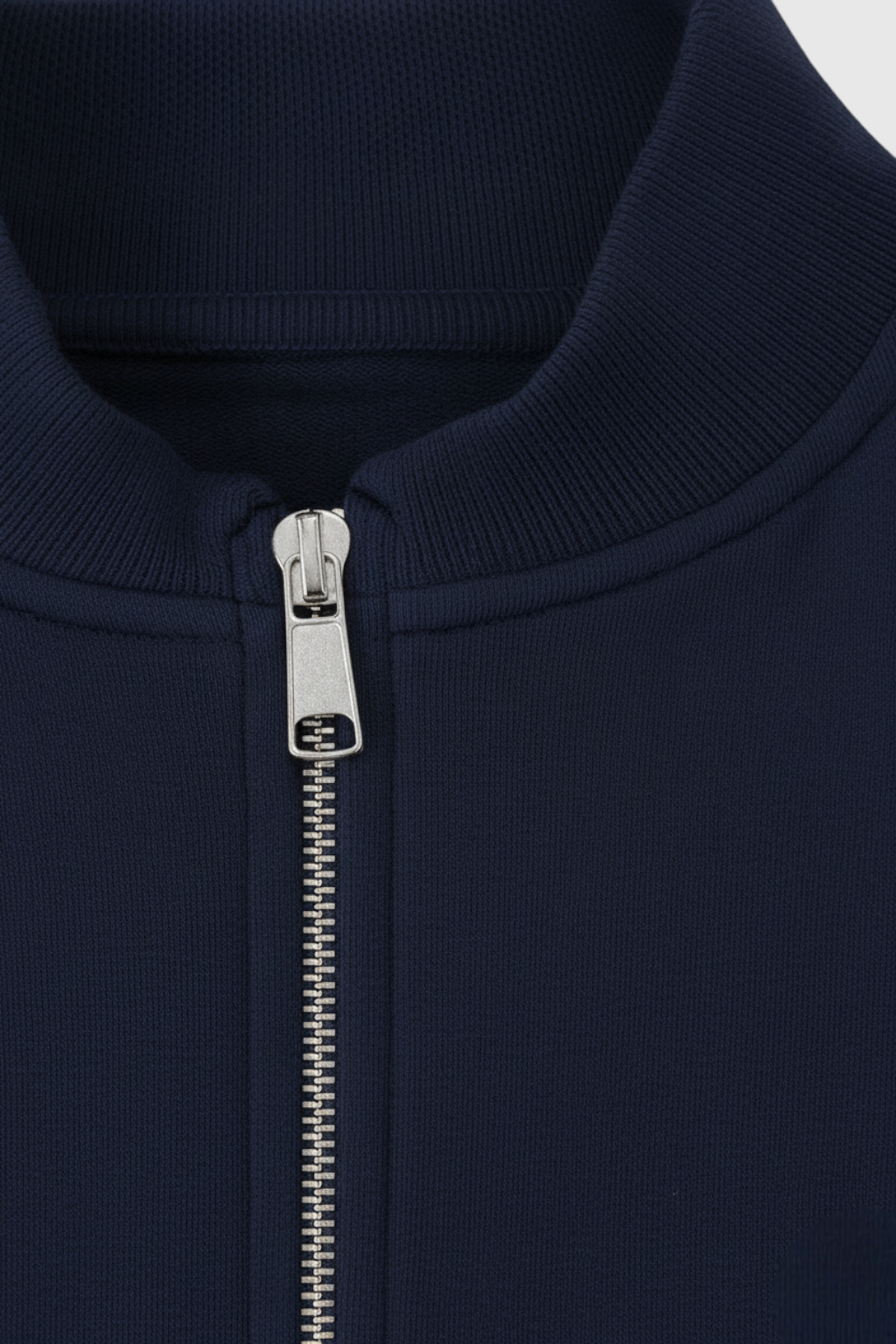 Victoria Lumina activewear set featuring dark blue relaxed fit sweatpants and sweatshirt with zipper accents.
