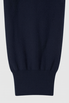 Victoria Lumina activewear set featuring relaxed fit dark blue sweatpants and sweatshirt with zipper accents, ideal for casual comfort.