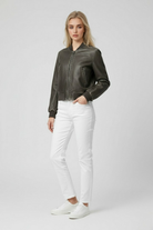 Victoria Lumina black retro-inspired bomber jacket with modern comfort, shown on a model with a casual urban background.