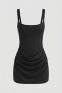 Victoria Lumina black mini dress with sculpted hourglass fit, featuring sleeveless design and stylish silhouette.