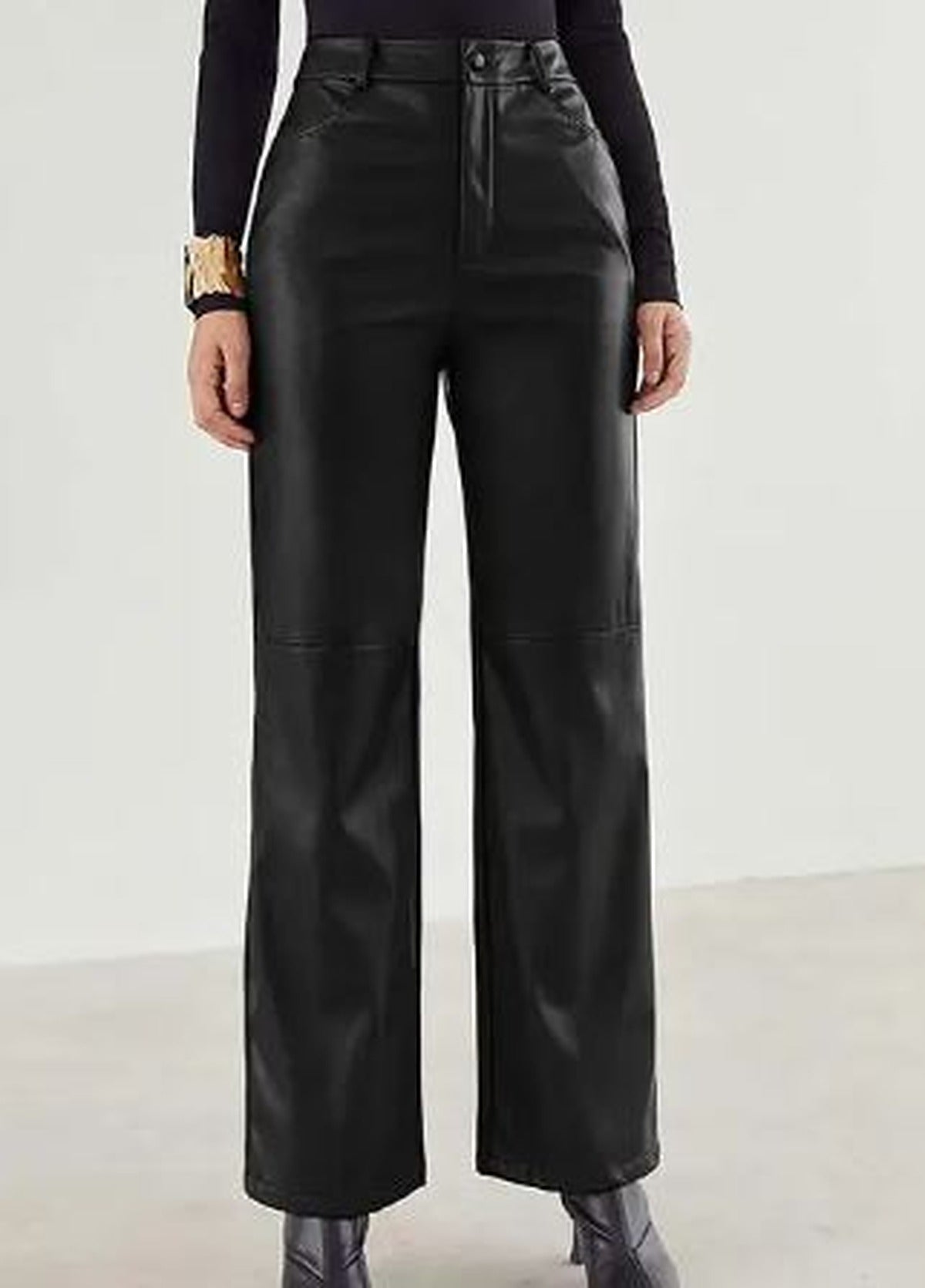 Victoria Lumina Wear slim fit black faux leather trousers for women with soft finish, shown on a model.