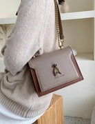 Khaki Victoria Lumina structured chain handbag with elegant detailing and chic accents, perfect for sophisticated style.