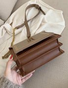 Lumina Wear Victoria structured chain bag in khaki with elegant detailing and chic accents, perfect for stylish occasions.