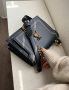 Lumina Wear Victoria structured chain bag in khaki with elegant detailing, chic design, and sophisticated handbag style.