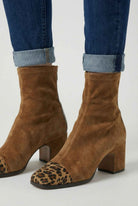 Stylish brown mid-calf women's boots with lace detail from Lumina Wear, featuring a sleek design and comfortable fit.