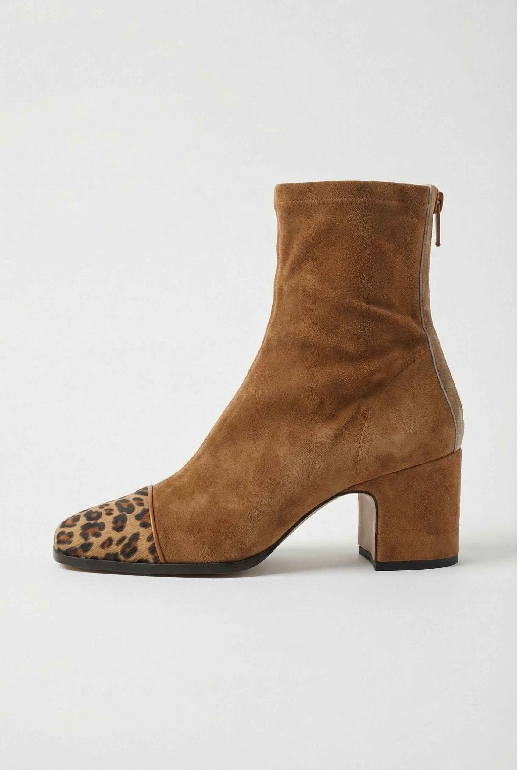 Stylish brown mid-calf women's boots with lace detail by Lumina Wear, showcasing the elegant design and textured leather finish.