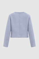 Light blue women's short jacket by Lumina Wear, stylish and versatile design perfect for casual or semi-formal outfits.
