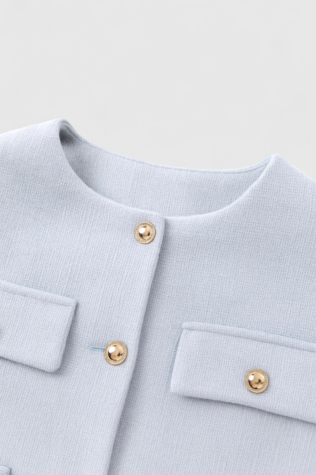 Light blue Victoria women's short jacket by Lumina Wear, featuring a versatile stylish design and casual fit.