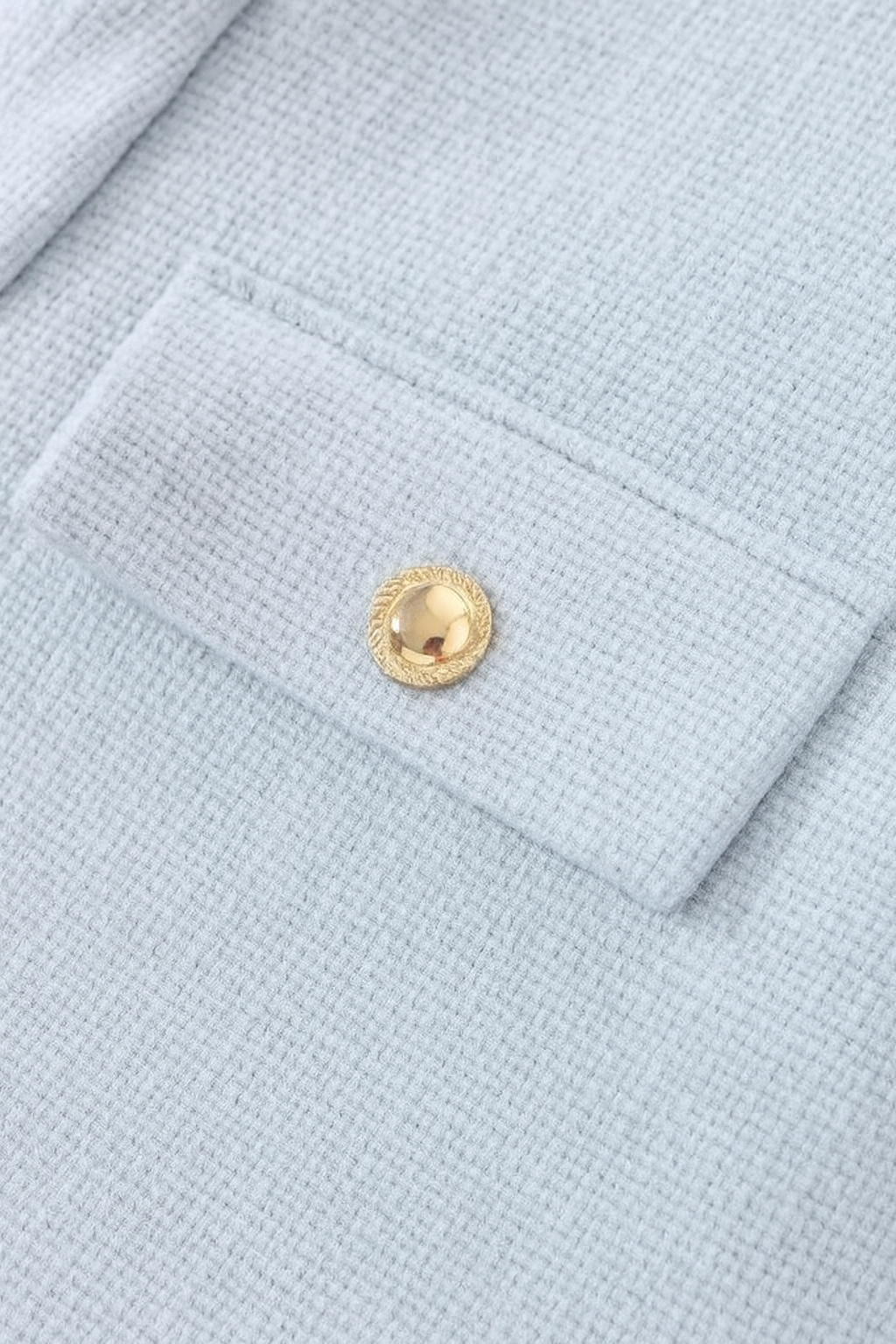 Light blue women's short jacket from Lumina Wear, stylish design with versatile look, perfect for casual and layered outfits.