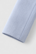 Light blue Victoria women's short jacket by Lumina Wear, featuring a stylish, versatile design for casual and layered looks.