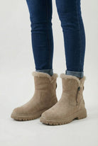 Brown Lumina Wear Victoria waterproof winter boots with a comfortable fit, featuring stylish design and sturdy soles.